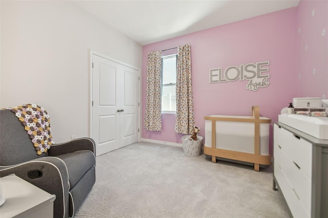 sitting room featuring sink and light colored carpet