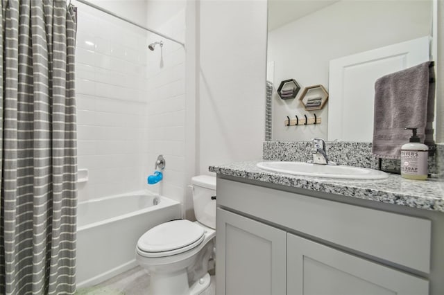 full bathroom featuring shower / bath combination with curtain, toilet, and vanity