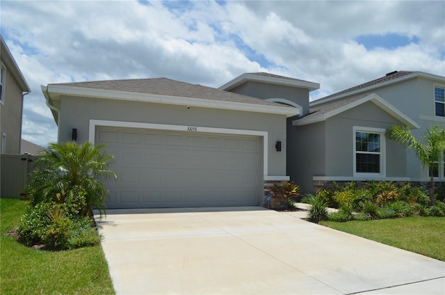 10058 Shoreline View Way, Wesley Chapel, FL 33545 - single story home featuring an attached garage, stucco siding, and concrete driveway
