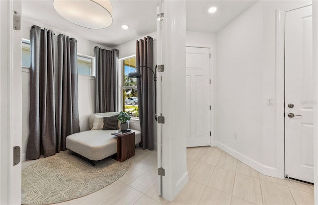 living area featuring light tile patterned floors