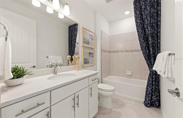 full bath featuring vanity, visible vents, shower / bath combo with shower curtain, tile patterned floors, and toilet