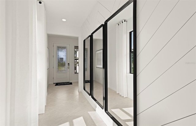 hallway with light tile patterned flooring