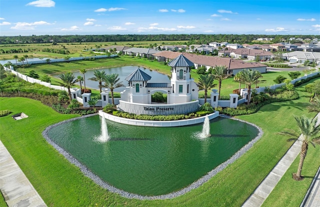 drone / aerial view featuring a residential view and a water view