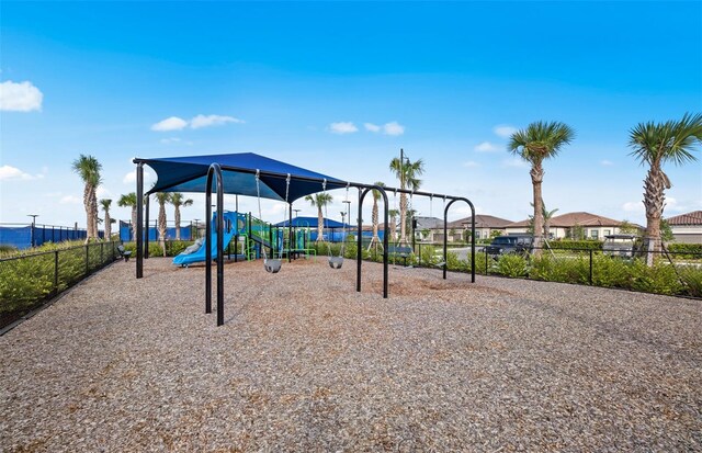 communal playground featuring fence