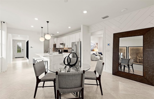 dining space with recessed lighting and visible vents