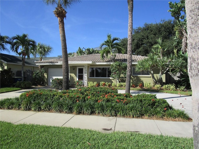 ranch-style house featuring a garage