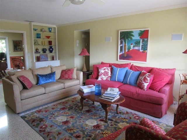 living room with ceiling fan and ornamental molding