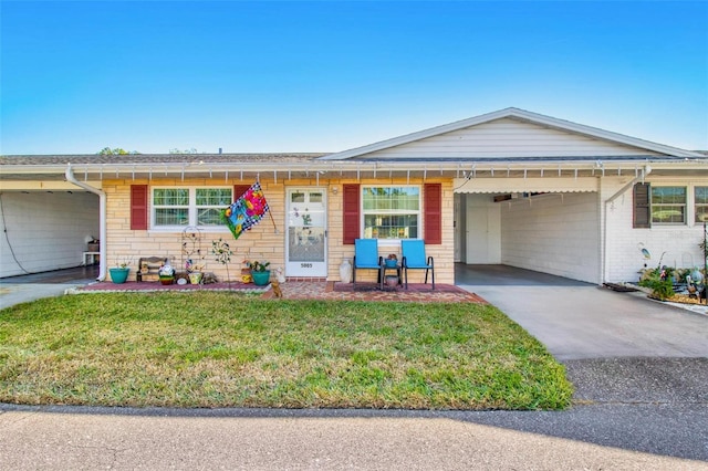 ranch-style home with a front yard and a carport