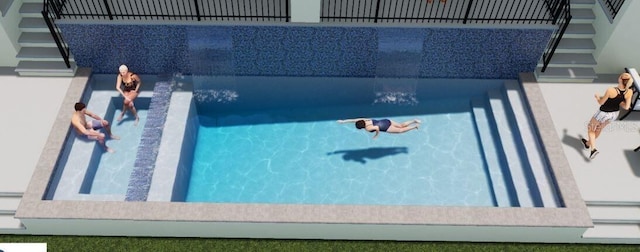 view of pool with a jacuzzi