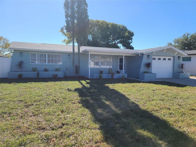 single story home with a front yard and a garage