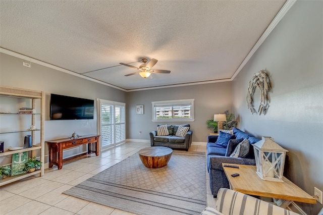 tiled living room featuring a textured ceiling, ceiling fan, and crown molding