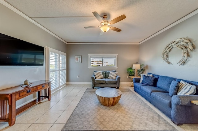 living room with a textured ceiling, ceiling fan, light tile patterned floors, and crown molding