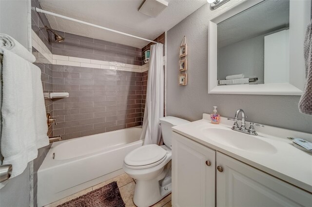 full bathroom featuring tile patterned flooring, shower / bath combo, vanity, and toilet