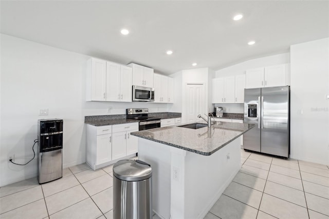 kitchen featuring light tile patterned flooring, sink, white cabinets, and stainless steel appliances