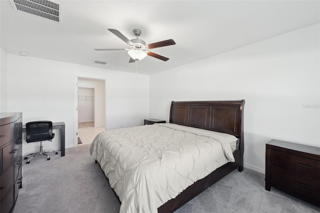 bedroom with light carpet and ceiling fan