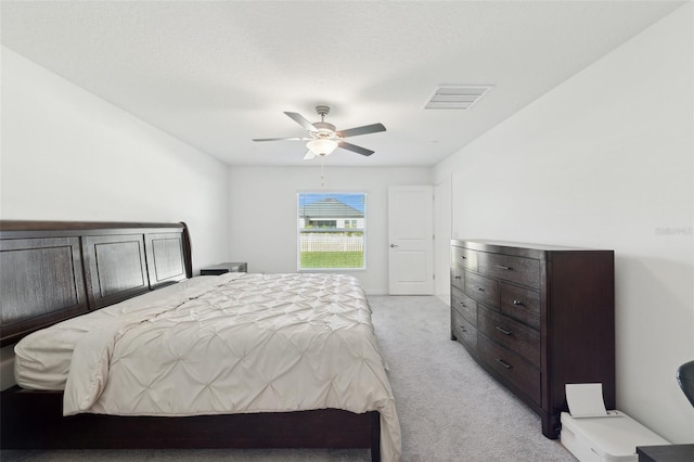 bedroom featuring ceiling fan and light colored carpet