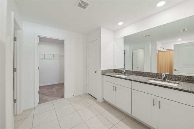 bathroom with tile patterned flooring, vanity, and a shower with curtain