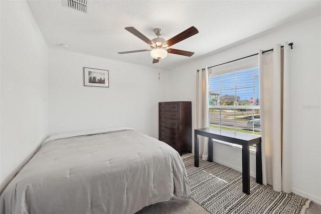 bedroom with light carpet and ceiling fan