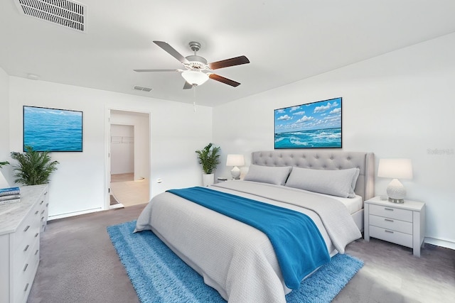 bedroom with ceiling fan, visible vents, and carpet flooring