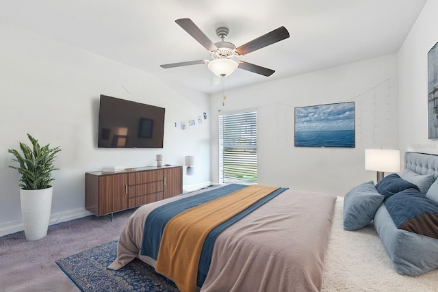 carpeted bedroom featuring ceiling fan and baseboards