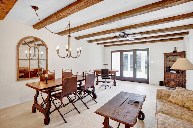 dining room with beam ceiling, ceiling fan with notable chandelier, light colored carpet, and french doors