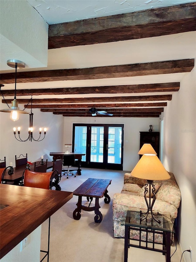 living room with beam ceiling, french doors, carpet, and a notable chandelier