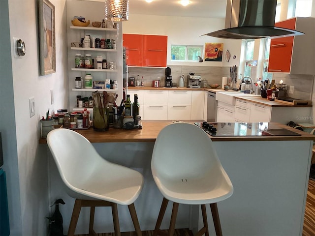 kitchen featuring dishwasher, island range hood, white cabinetry, and tasteful backsplash