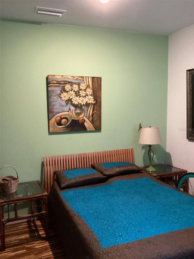 bedroom featuring wood-type flooring