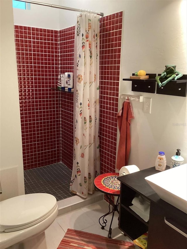 bathroom with curtained shower, tile patterned flooring, vanity, and toilet