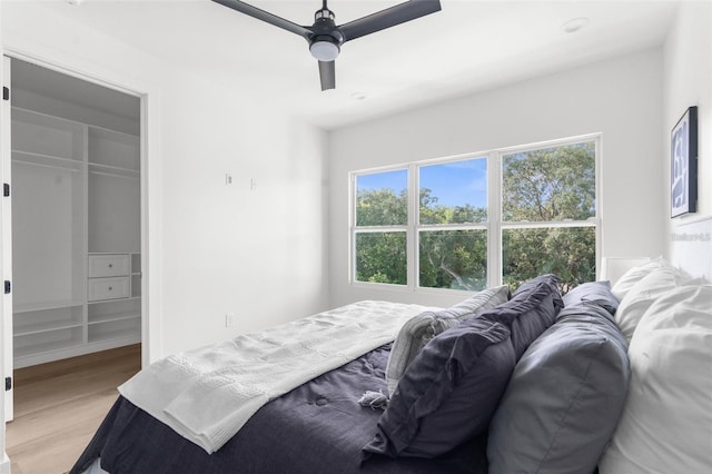 bedroom featuring ceiling fan and light hardwood / wood-style floors