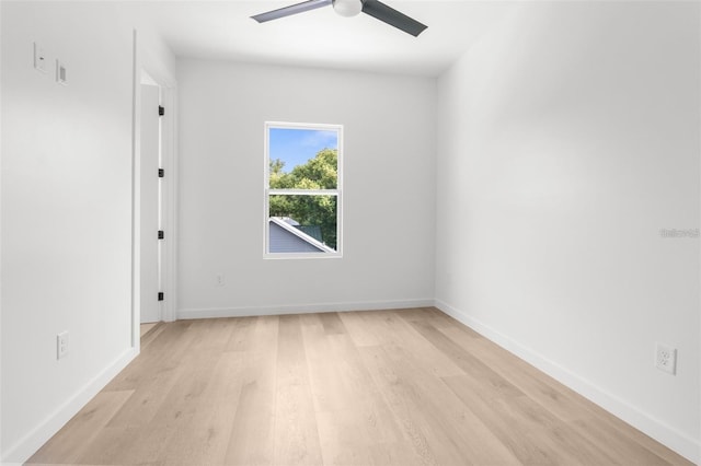 spare room featuring ceiling fan and light wood-type flooring