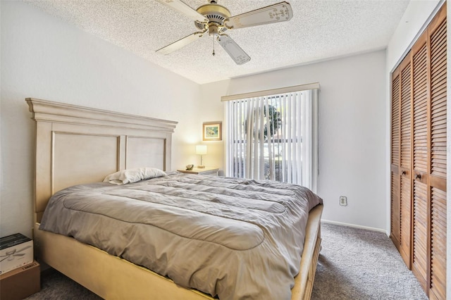 carpeted bedroom featuring ceiling fan, a closet, and a textured ceiling