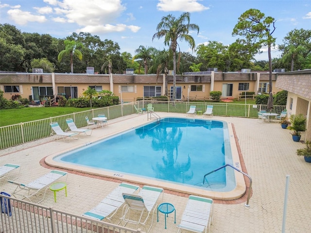 view of swimming pool with a patio area