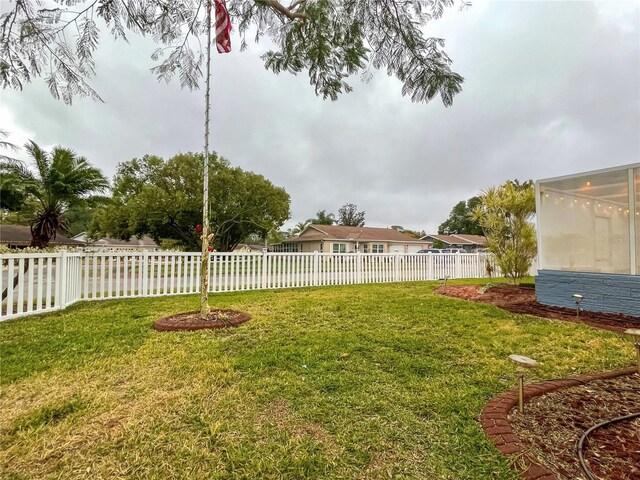 view of yard with a sunroom