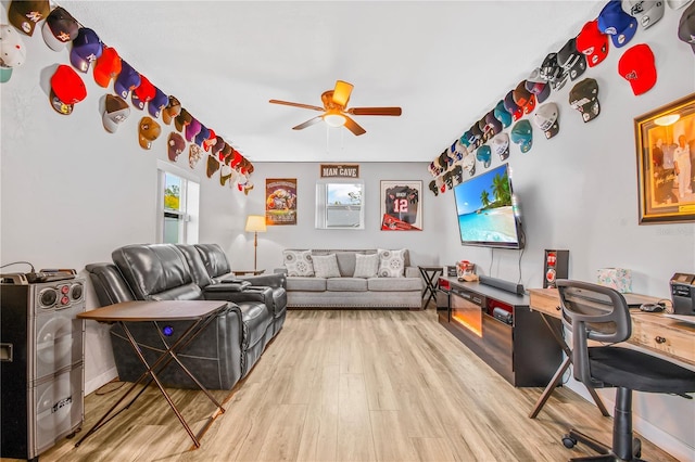 interior space with washer / clothes dryer, hardwood / wood-style floors, and ceiling fan