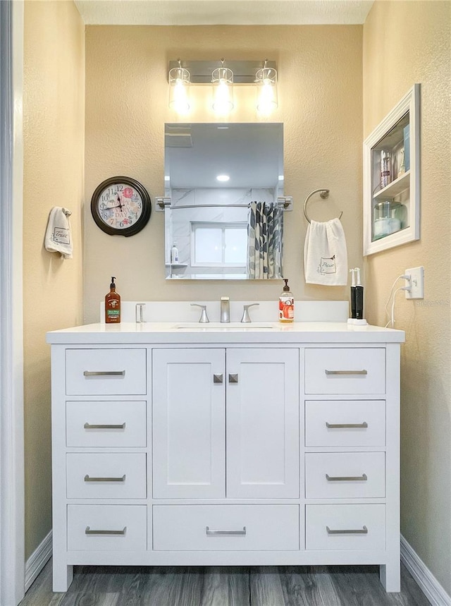 bathroom with wood-type flooring and vanity