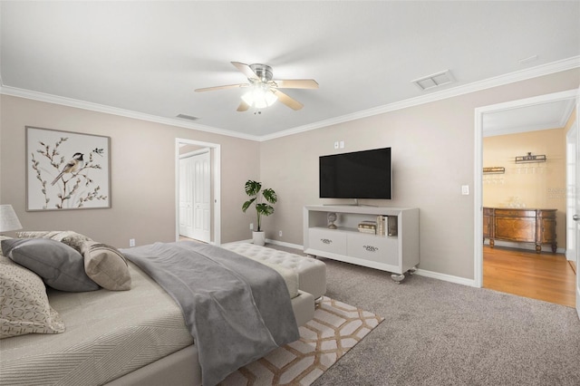 bedroom featuring carpet, ceiling fan, and ornamental molding