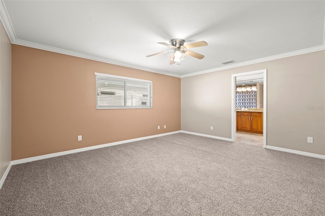 unfurnished room with light colored carpet, ceiling fan, and ornamental molding