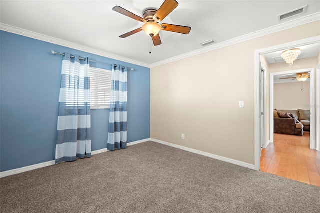 spare room featuring wood-type flooring, ceiling fan, and ornamental molding