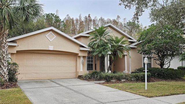 view of front of house with a front yard and a garage