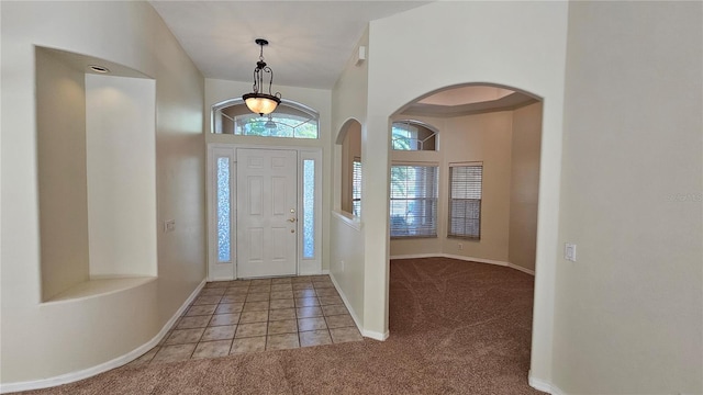 view of carpeted foyer