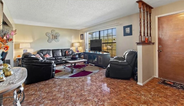 living room with a textured ceiling