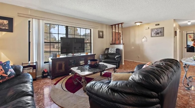 living room with a textured ceiling