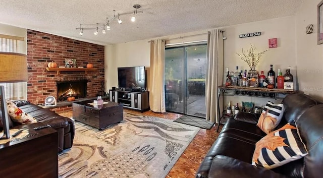 living room with bar, a fireplace, plenty of natural light, and a textured ceiling