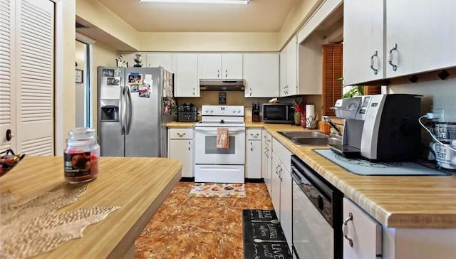 kitchen with white cabinets, appliances with stainless steel finishes, and sink