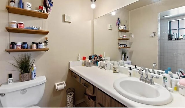 bathroom featuring vanity and toilet