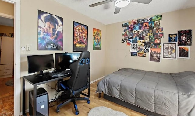 bedroom with wood-type flooring and ceiling fan