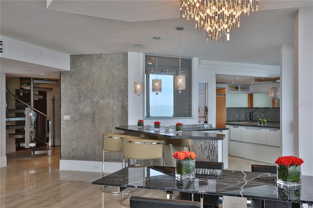 dining room with light tile patterned floors and sink