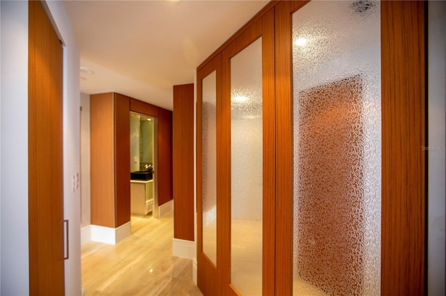 hall featuring french doors and light hardwood / wood-style floors