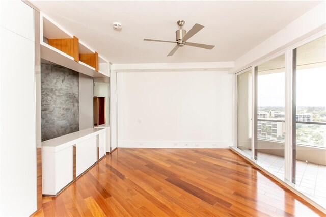 spare room featuring ceiling fan and light hardwood / wood-style flooring